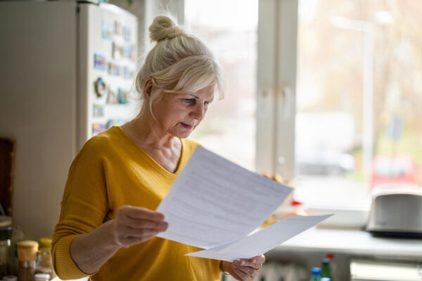 a woman holding a piece of paper